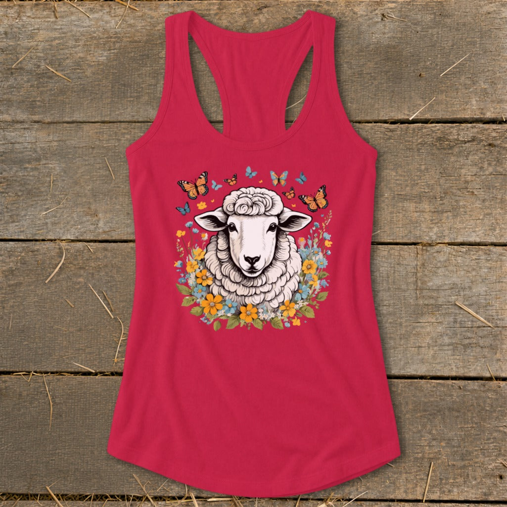 Pink tank top with a sheep surrounded by flowers and butterflies graphic.