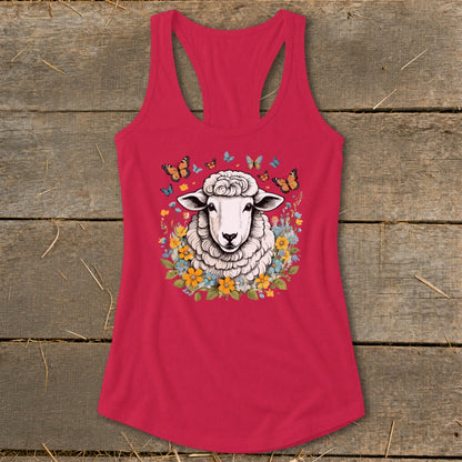 Pink tank top with a sheep surrounded by flowers and butterflies graphic.