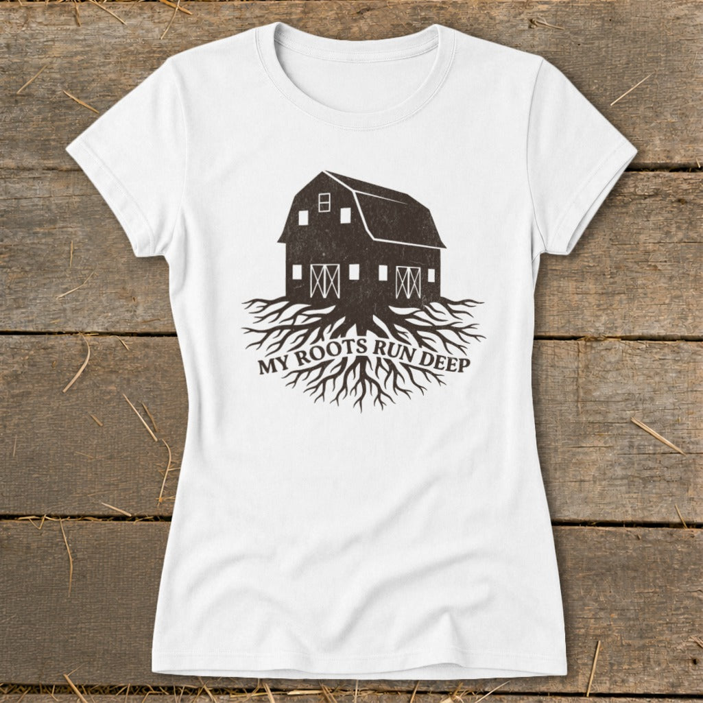 White t-shirt with dark barn graphic and "MY ROOTS RUN DEEP" text.