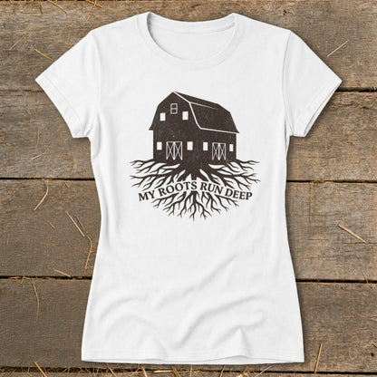 White t-shirt with dark barn graphic and "MY ROOTS RUN DEEP" text.