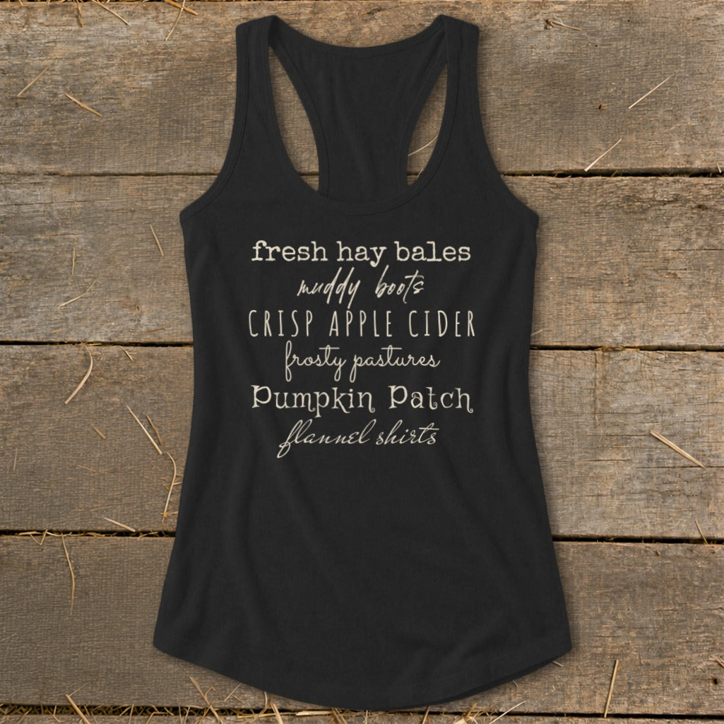 Black tank top with white text listing autumn activities.