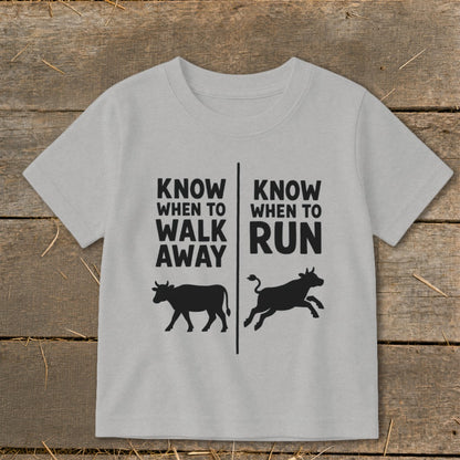 Gray t-shirt with black text and cow silhouettes: "Know When to Walk Away" and "Know When to Run".