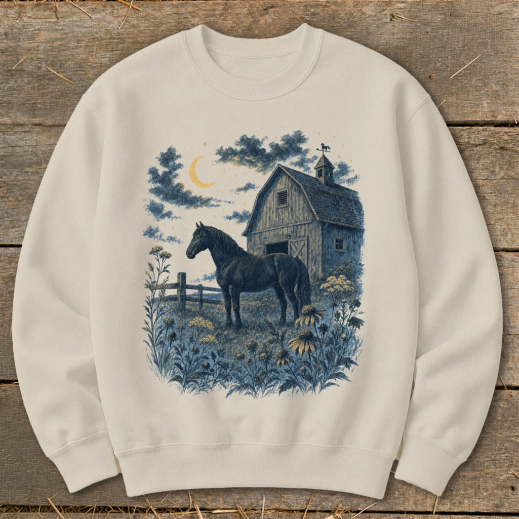 Black horse stands in a field by a barn under a crescent moon.