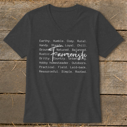 Dark grey v-neck t-shirt with white text listing words like "Earthy," "Rustic," and "Farmerish."