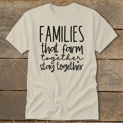 Light-colored t-shirt with black text "FAMILIES that farm together stay together."