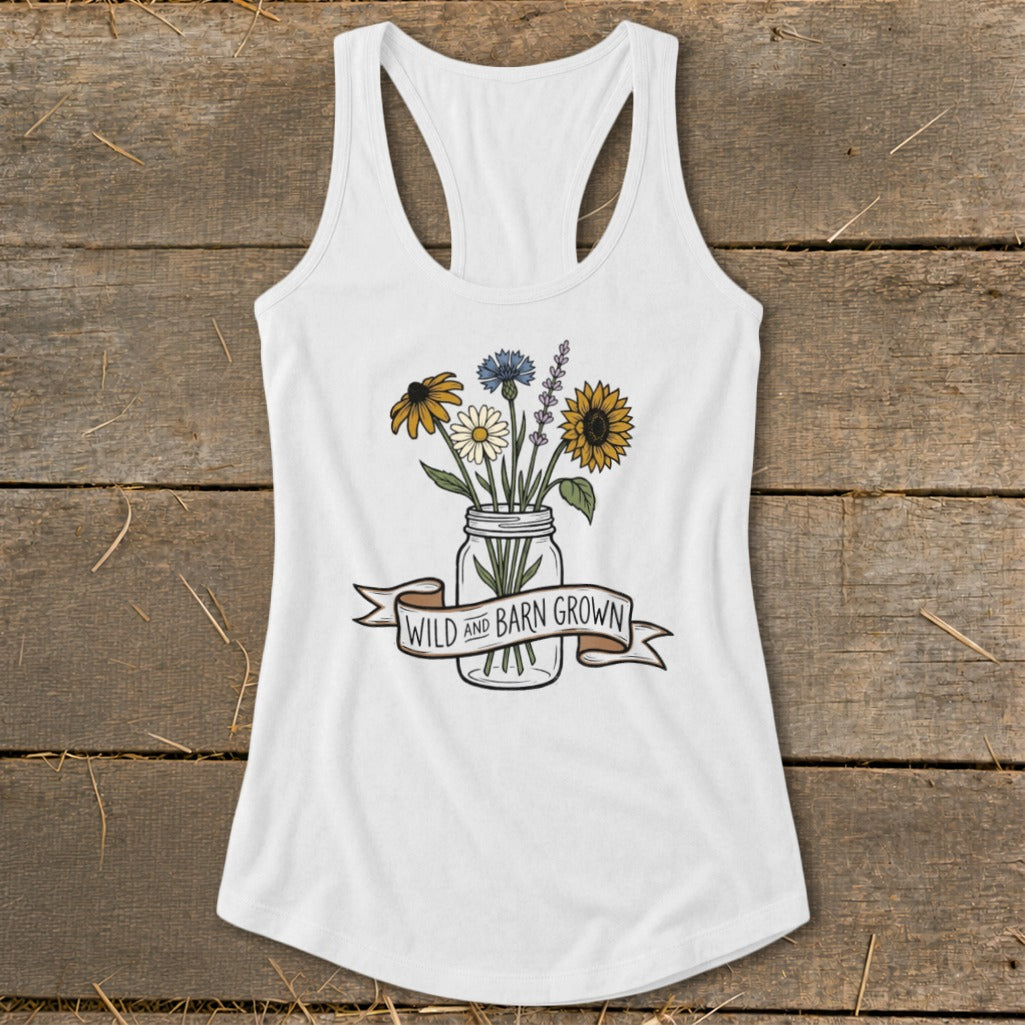 White tank top with a mason jar of wildflowers and a banner reading "Wild and Barn Grown".