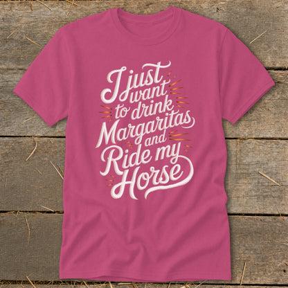 Pink t-shirt with "I just want to drink Margaritas and Ride my Horse" text.