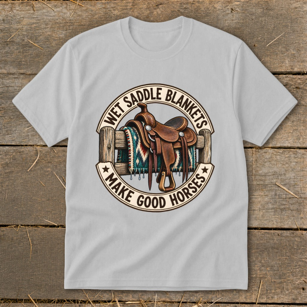 Western saddle on a fence with blanket, text reads "Wet Saddle Blankets Make Good Horses."