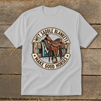 Western saddle on a fence with blanket, text reads "Wet Saddle Blankets Make Good Horses."