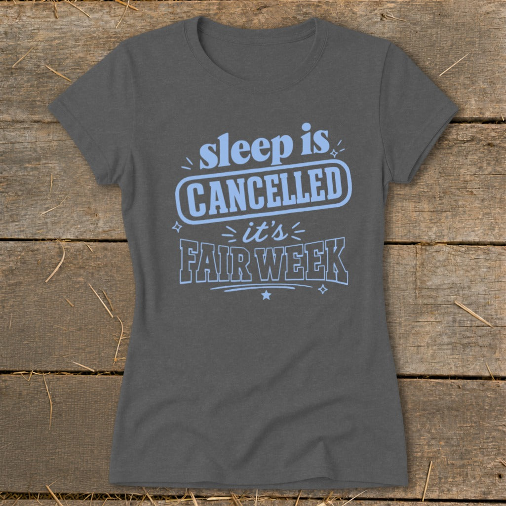 Gray t-shirt with light blue text reading "sleep is CANCELLED it's FAIR WEEK".
