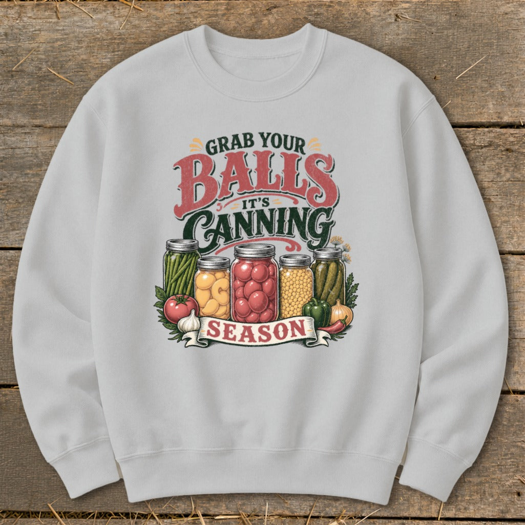 Gray sweatshirt with "Grab Your Balls It's Canning Season" text and jars of produce.