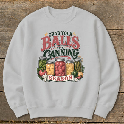 Gray sweatshirt with "Grab Your Balls It's Canning Season" text and jars of produce.