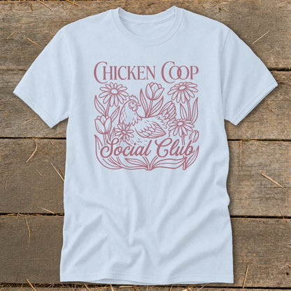 Light blue t-shirt with "Chicken Coop Social Club" text and a chicken with flowers graphic.