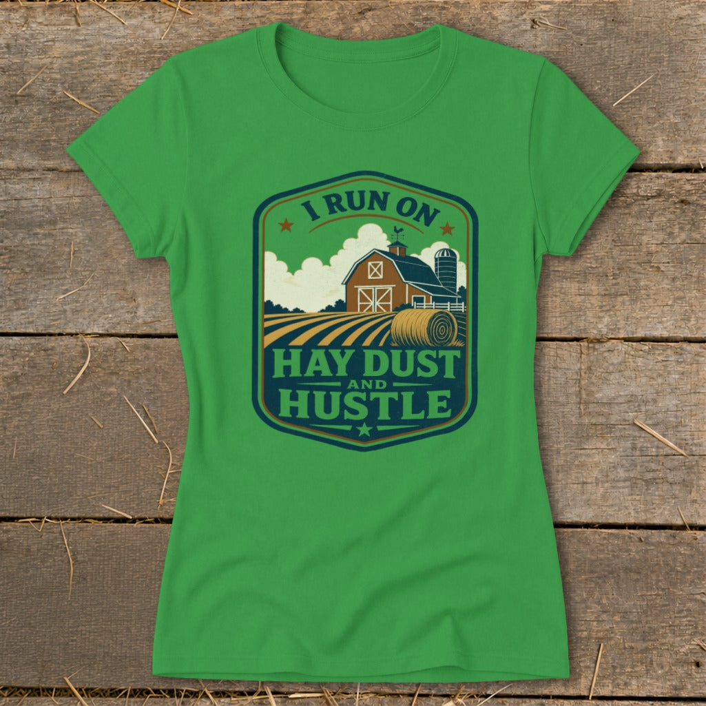 Green t-shirt with badge graphic: "I Run On Hay Dust And Hustle".