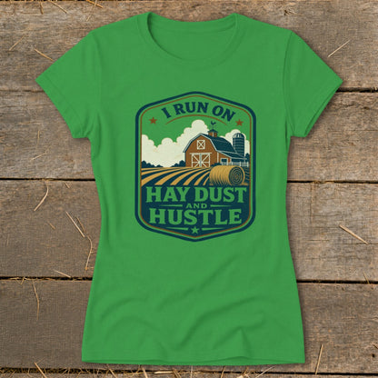 Green t-shirt with badge graphic: "I Run On Hay Dust And Hustle".