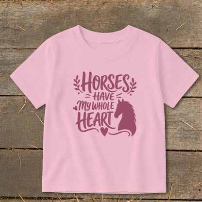 Pink t-shirt with purple text and horse silhouette reading "Horses have my whole heart".