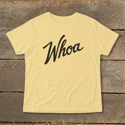 Yellow t-shirt with "Whoa" printed in black cursive text.