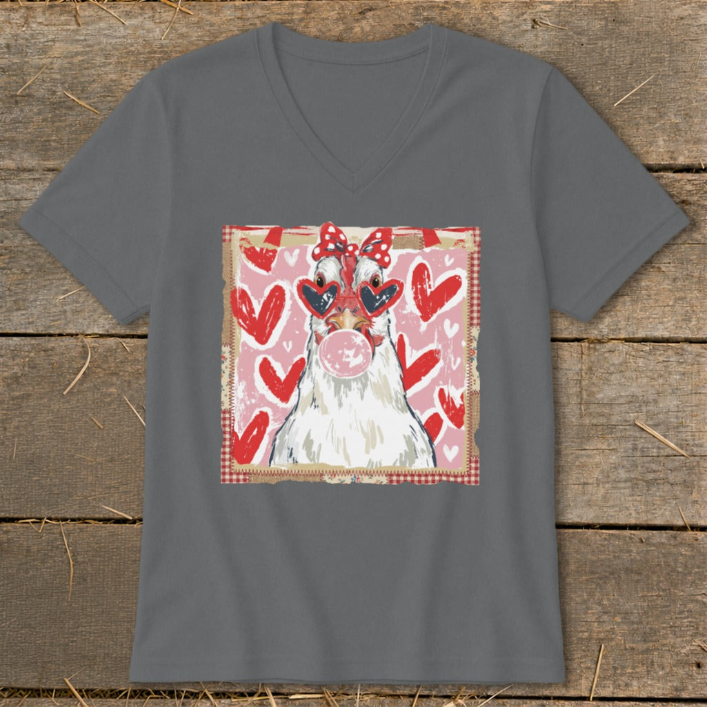Chicken wearing heart sunglasses and bow, blowing bubble gum, surrounded by hearts.