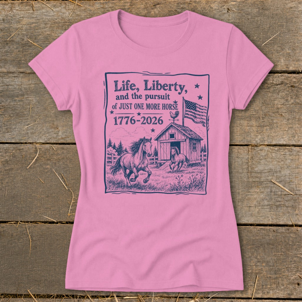 Pink t-shirt with graphic of horses, barn, American flag, and text.