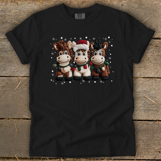 Three cartoon horses wearing Christmas decorations and a Santa hat.