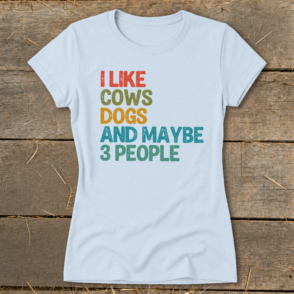 Light blue t-shirt with text "I LIKE COWS DOGS AND MAYBE 3 PEOPLE"