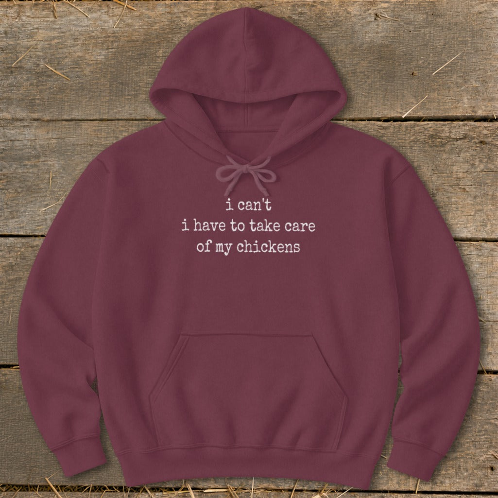 Maroon hooded sweatshirt with "i can't i have to take care of my chickens" text.