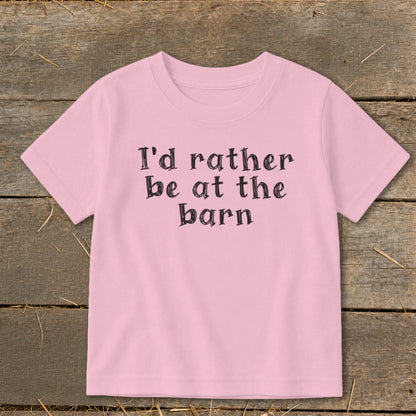 Pink t-shirt with "I'd rather be at the barn" text in black lettering.