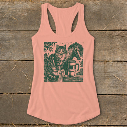 Peach tank top with green linocut of cat, horse, barn, mug, and fence.
