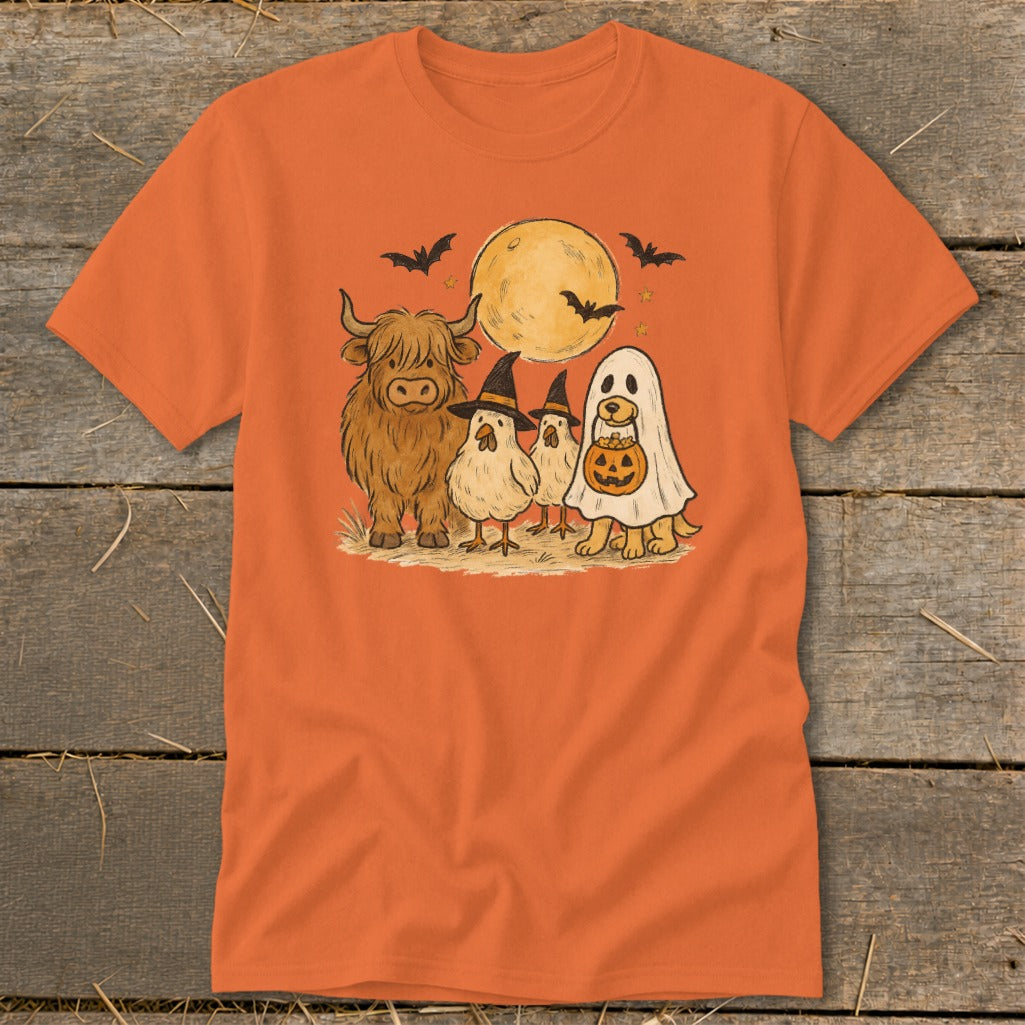 Highland cow, chicks, and dog in Halloween costumes under a moon with bats.