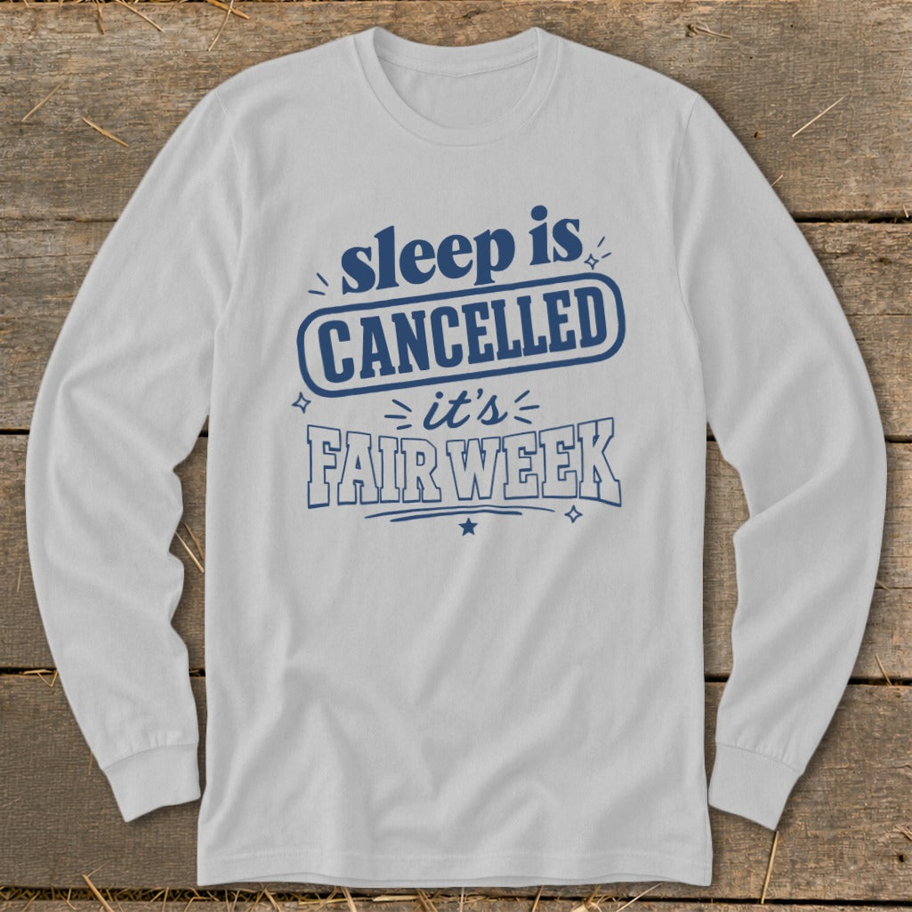 White long sleeve shirt with "sleep is CANCELLED it's FAIR WEEK" in blue text.