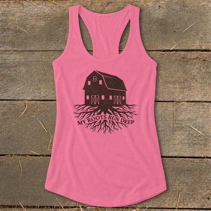 Pink tank top with barn and roots graphic and text "MY ROOTS RUN DEEP".