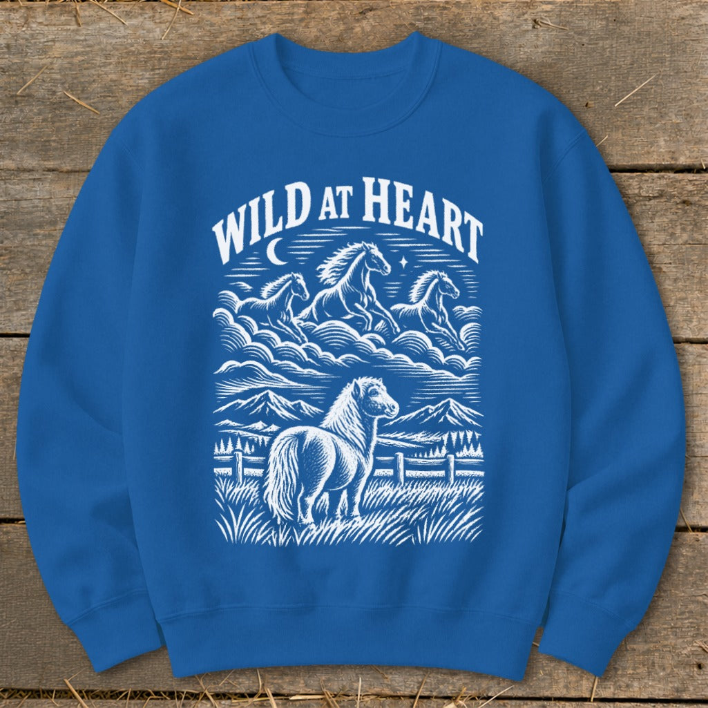 Royal blue sweatshirt with white "Wild at Heart" text and horse graphic.