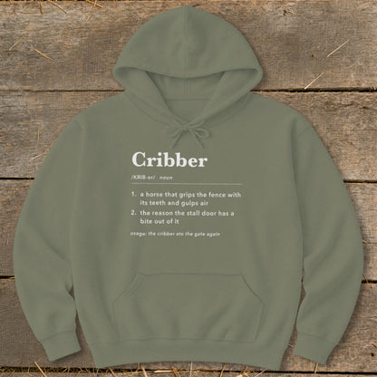 An olive green hoodie printed with a humorous dictionary definition of the word cribber.