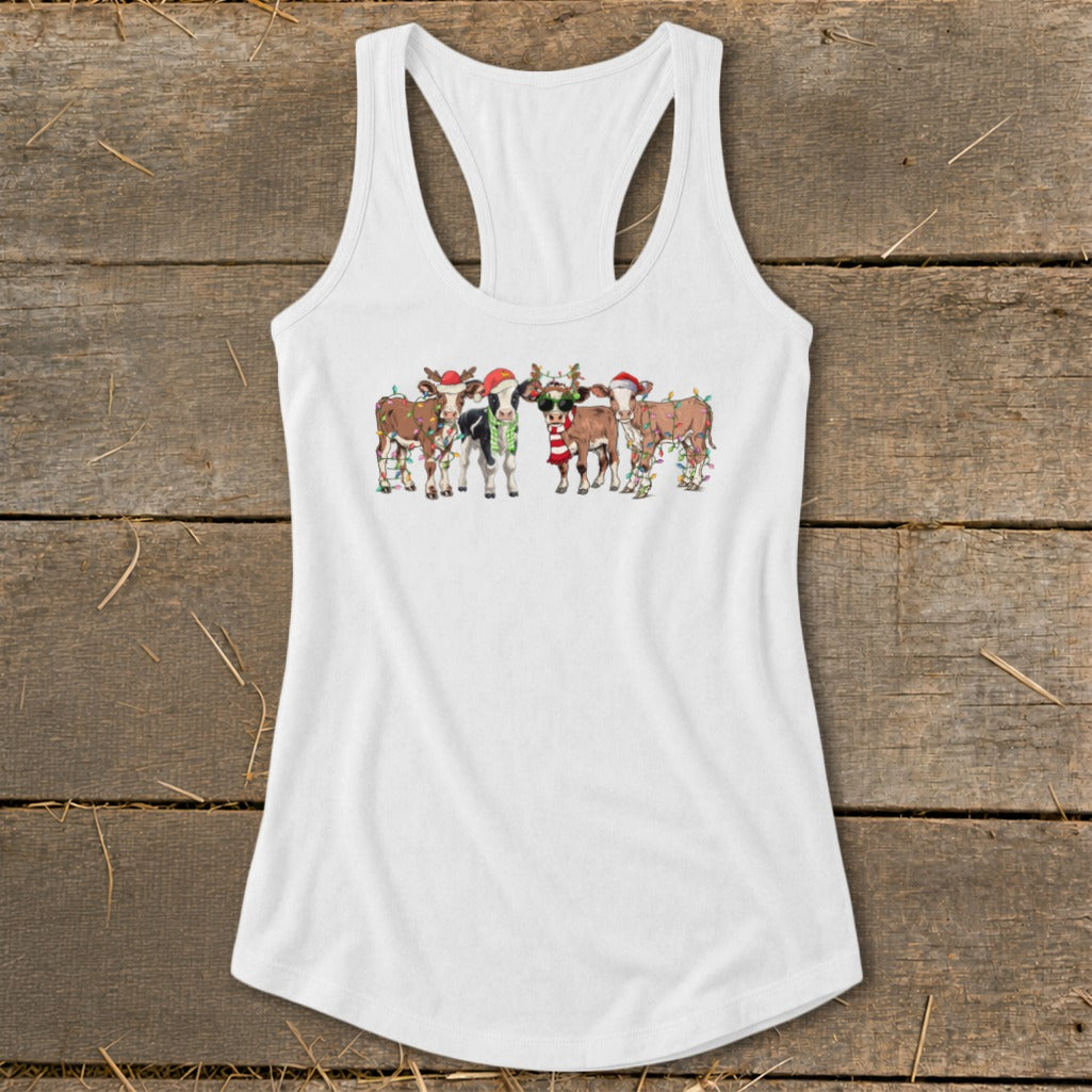 Five festive cows wearing Santa hats and lights on a white tank top.