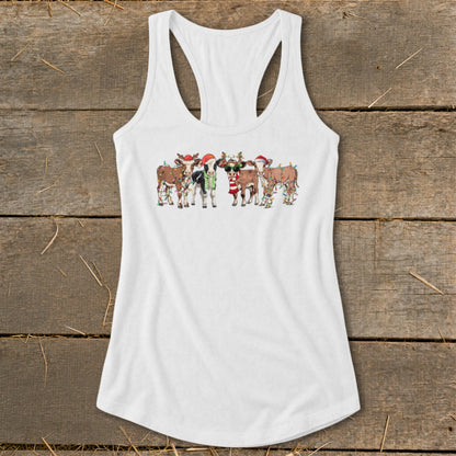 Five festive cows wearing Santa hats and lights on a white tank top.