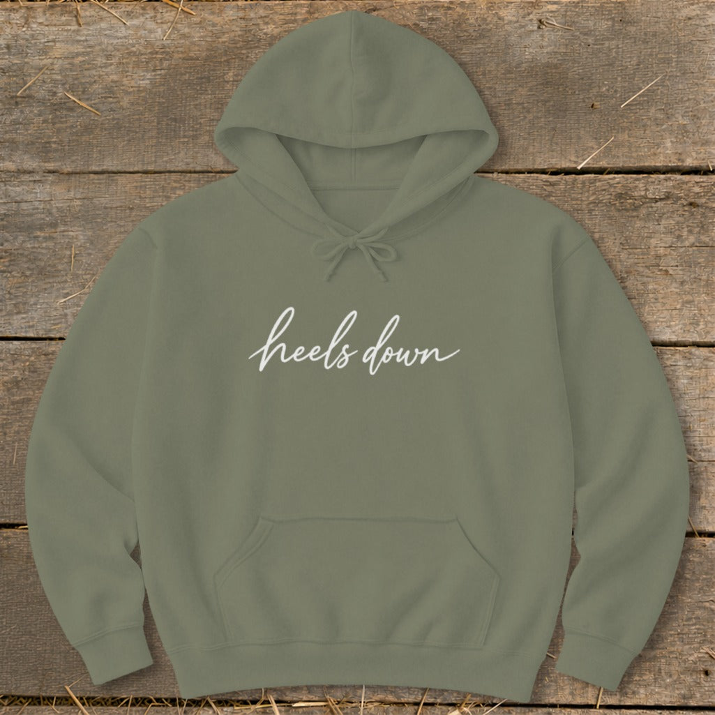 Olive green hoodie with "heels down" text in white script.