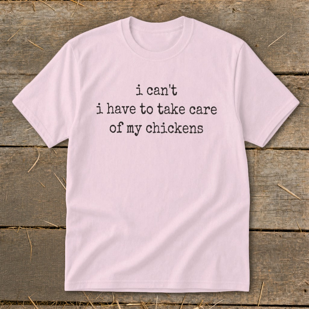 Pink t-shirt with black text: "i can't i have to take care of my chickens".