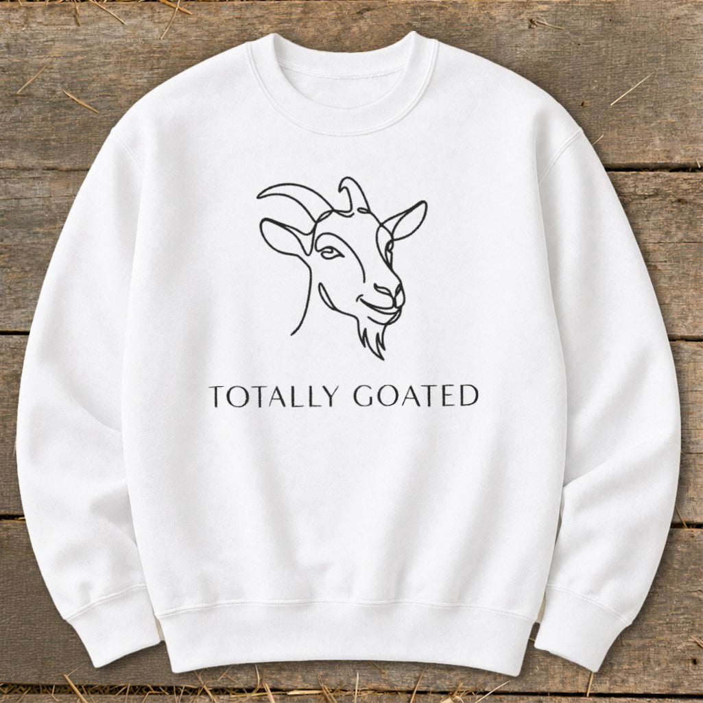 White sweatshirt with line art goat and text "TOTALLY GOATED".