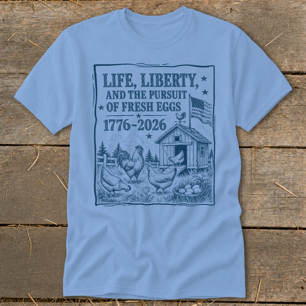 T-shirt graphic with text "Life, Liberty, and the Pursuit of Fresh Eggs" and chickens.