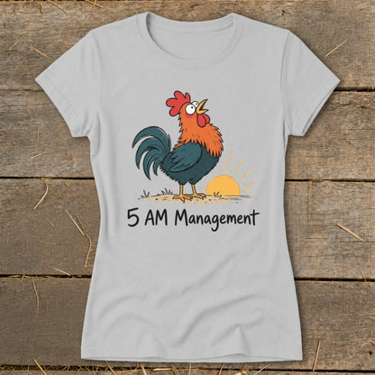 Light grey t-shirt with a cartoon rooster crowing at sunrise, text reads "5 AM Management".