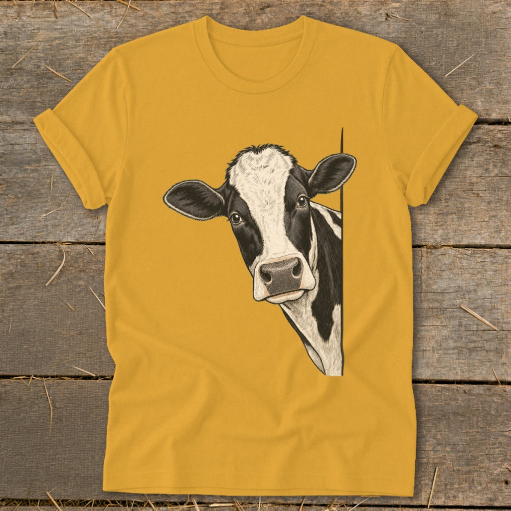Yellow t-shirt with black and white cow illustration peeking from the right.