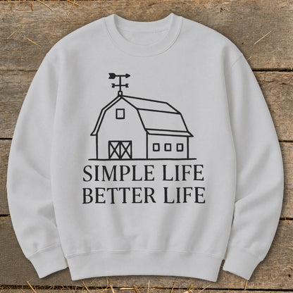White sweatshirt with black barn graphic and text "SIMPLE LIFE BETTER LIFE."