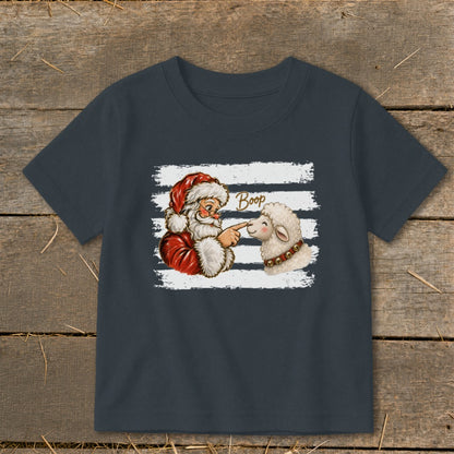 Santa booping a sheep with "Boop" written above, on a dark shirt.