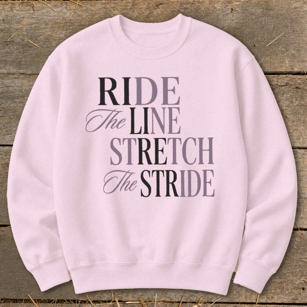 Pink sweatshirt with "RIDE The LINE STRETCH The STRIDE" text.