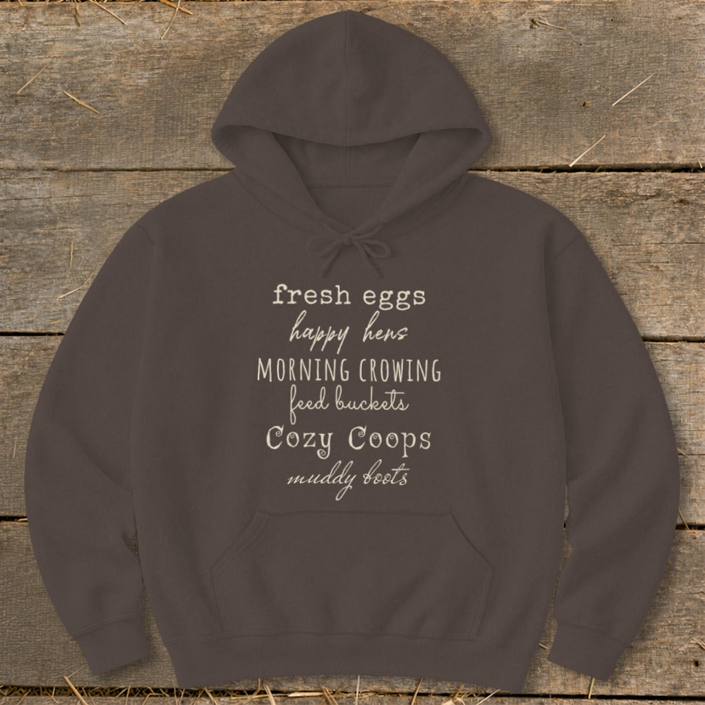 Brown hoodie with text: "fresh eggs happy hens MORNING CROWING feed buckets Cozy Coops muddy boots"
