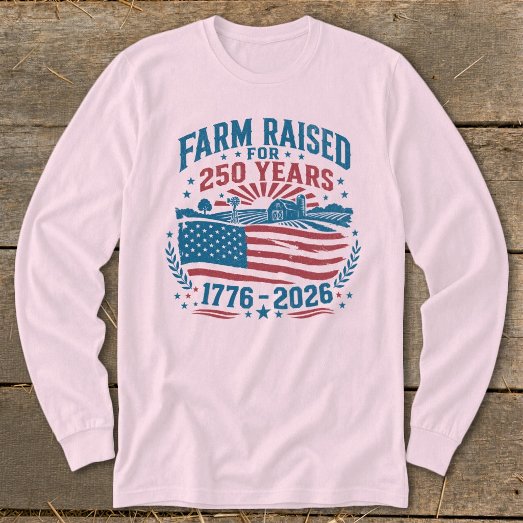 Farm raised for 250 years, 1776-2026 graphic on a light pink shirt.
