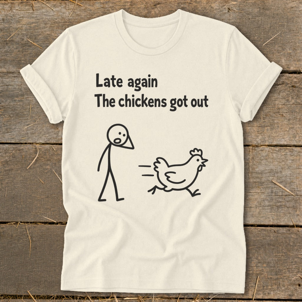 T-shirt with text "Late again The chickens got out" and stick figures of person and chicken.