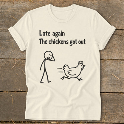 T-shirt with text "Late again The chickens got out" and stick figures of person and chicken.