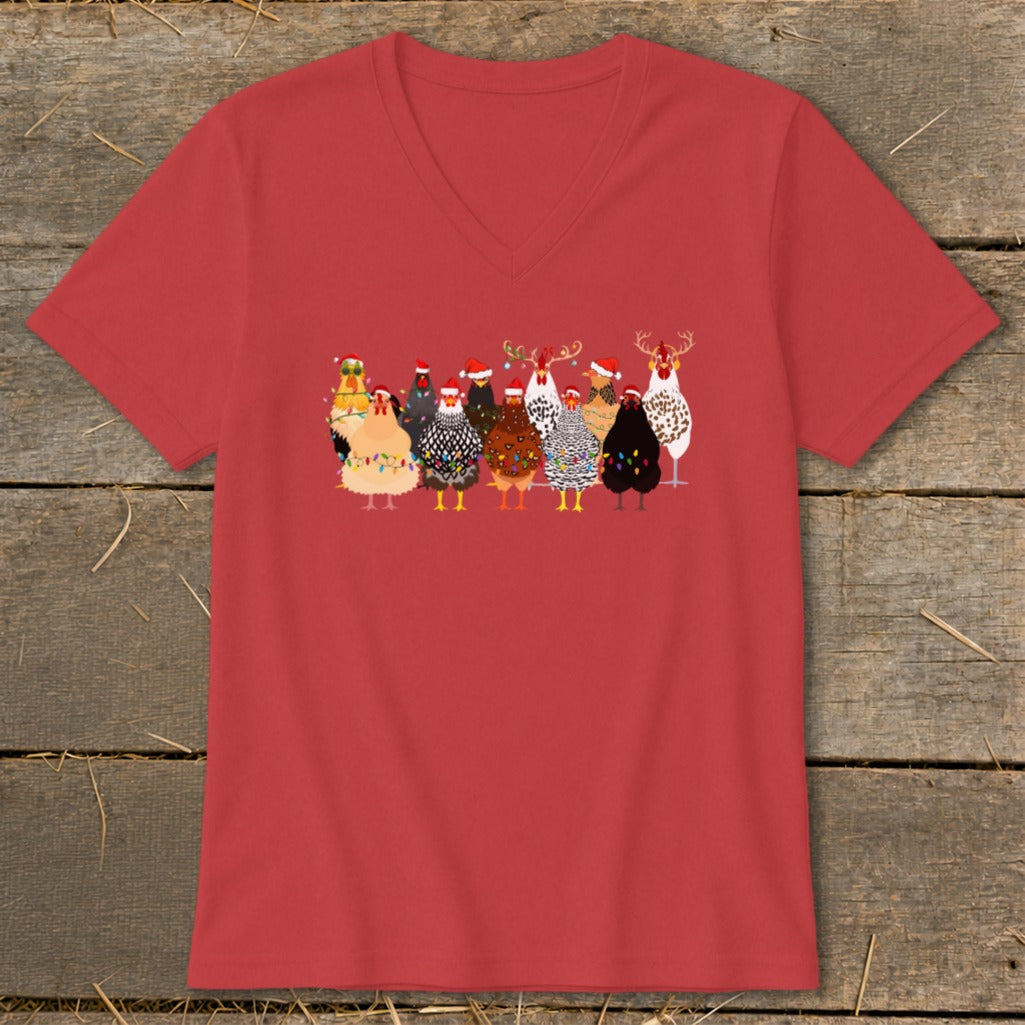 Red v-neck t-shirt with a herd of cartoon chickens in Christmas hats and lights.