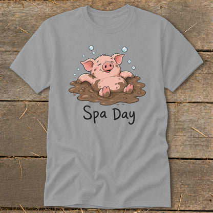 T-shirt with cartoon pig in mud bath and text "Spa Day".